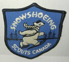 Load image into Gallery viewer, Scouts Canada Snowshoeing Polar Bear Vintage Cloth Sew on Patch NWOT New Shield Shape
